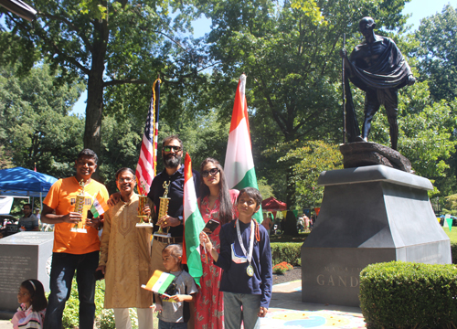 Posing by Gandhi statue in India Garden